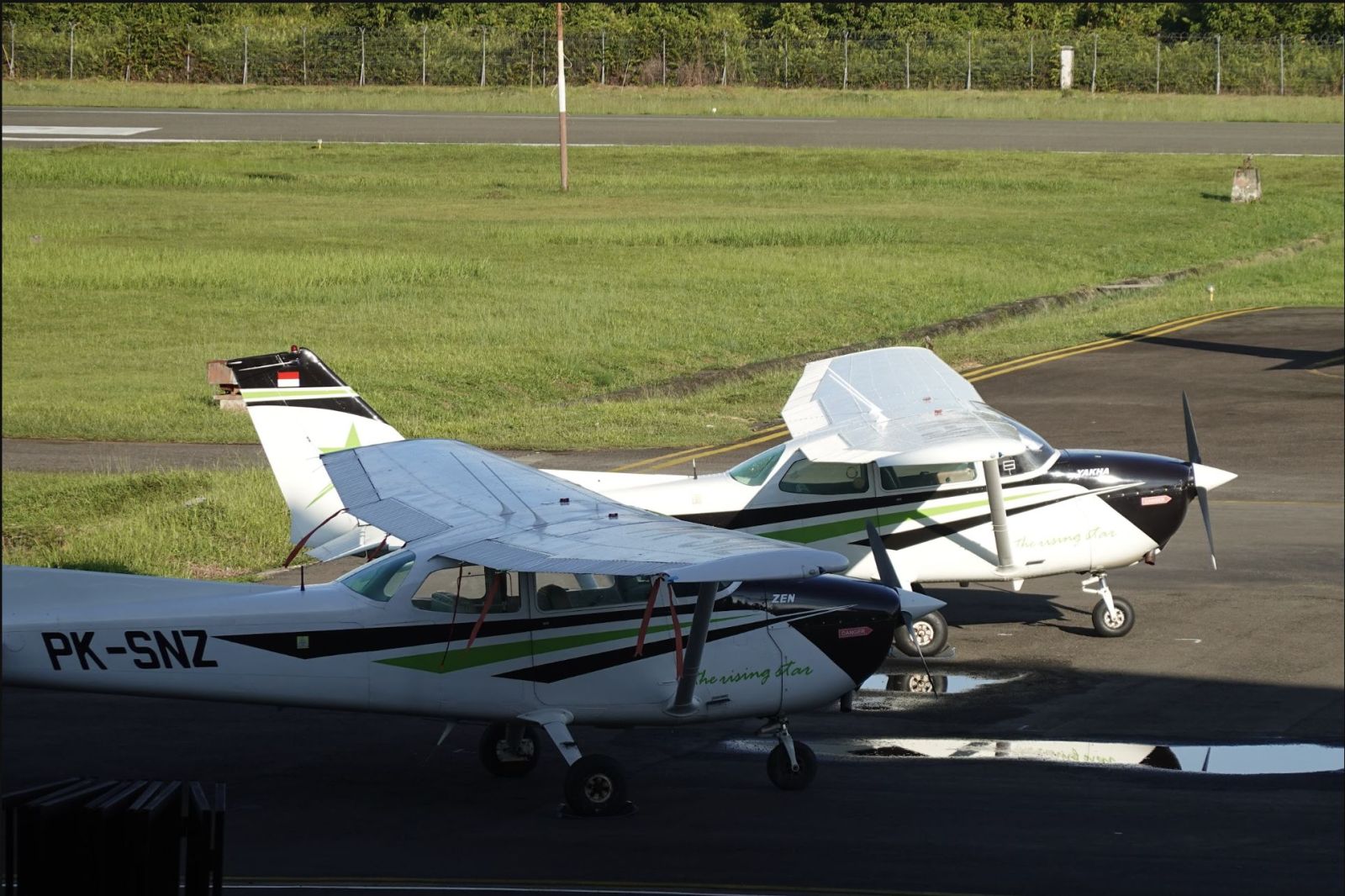 Two Smart Flying School Cessna 172 training aircraft on the apron