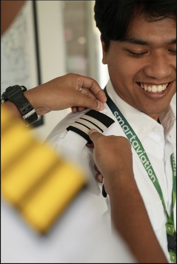 Epaulettes being pinned onto a Smart Flying School student